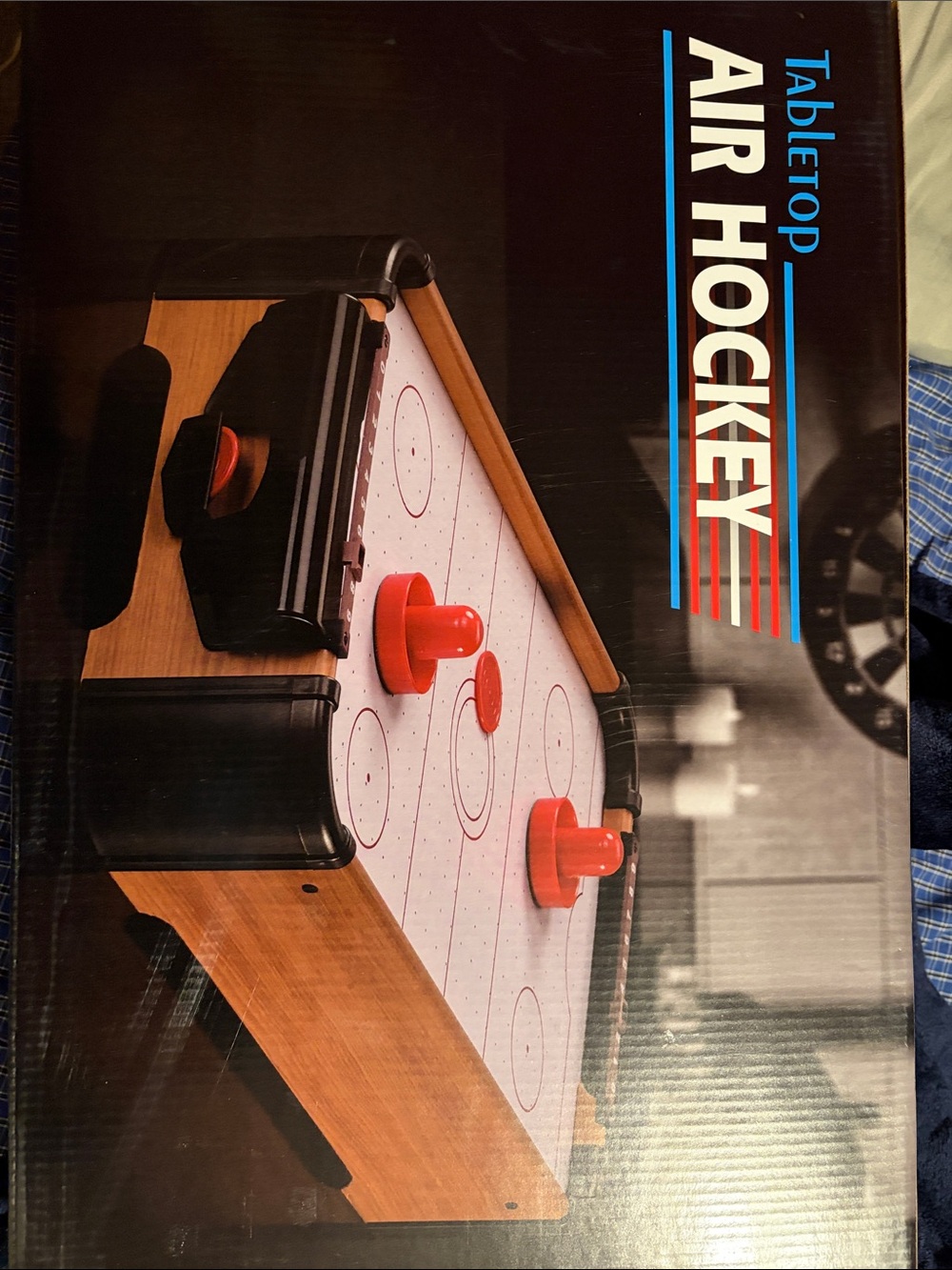 Tabletop Air Hockey Game with Red Pucks and Strikers